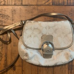 Tan and gold Coach crossbody. Gold “C”s with sparkle threading. Silver hardware.